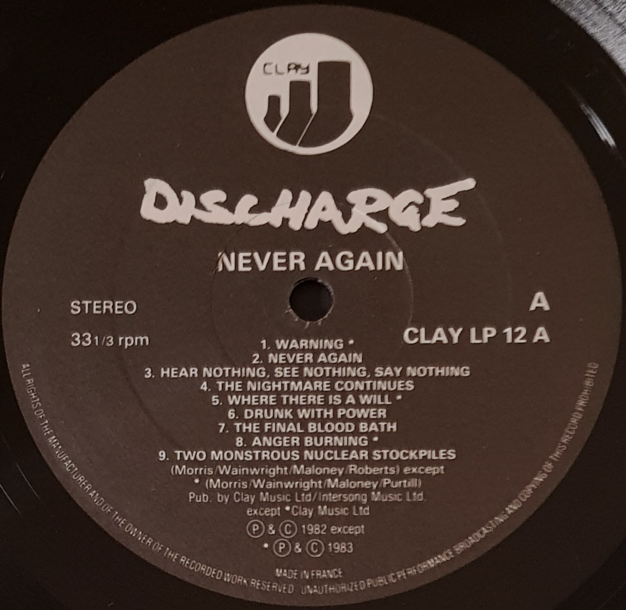 Discharge - Never Again, A Classic Clay Records LP Album
